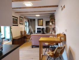 Apartament de vanzare 105 mp 3 camere curte 340 mp in acte Cisnadie